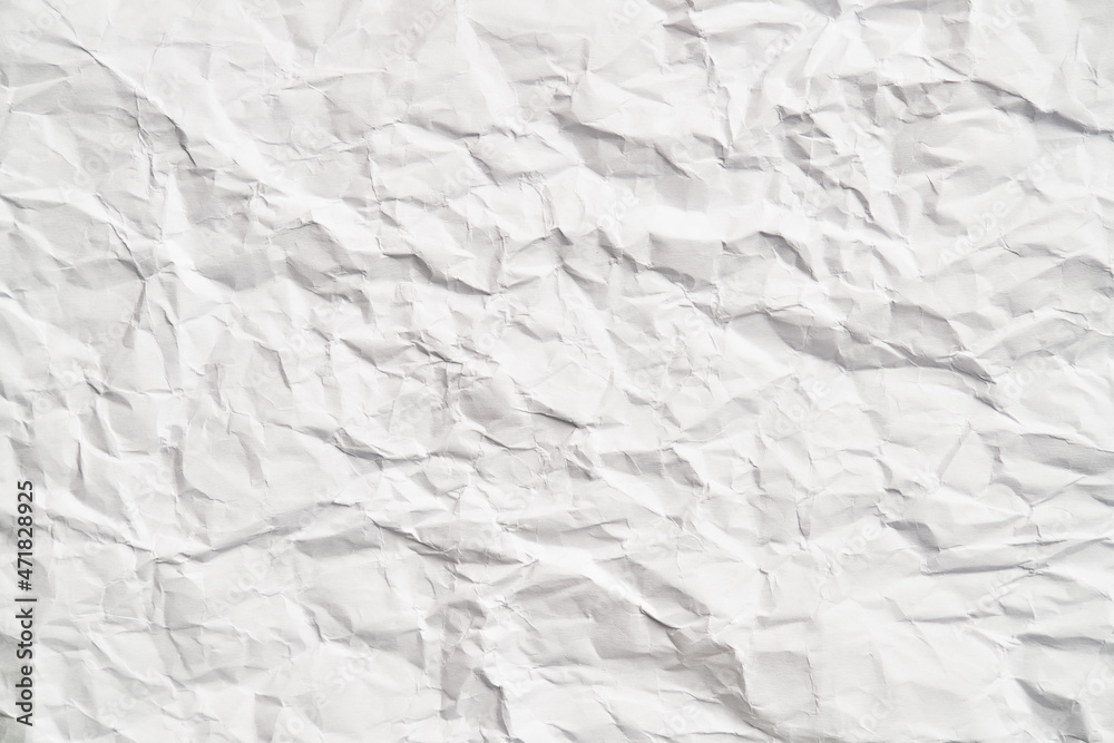 White crumpled paper texture with wrinkles. Damaged and torn sheet White crumpled paper texture with wrinkles. Damaged and torn sheet