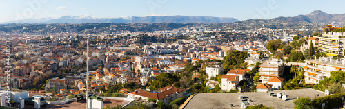 Panoramic view of Nice residential districts against backdrop of Alps in sunny day, France © JackF