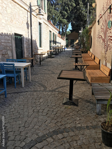 Retro style cafe in the street with cobblestones © Altan