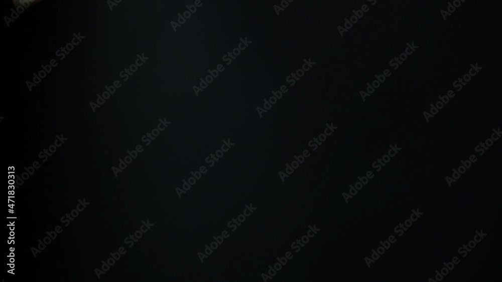 Slow flow towards euro banknotes currency movement background, money flying endless flow on black background.