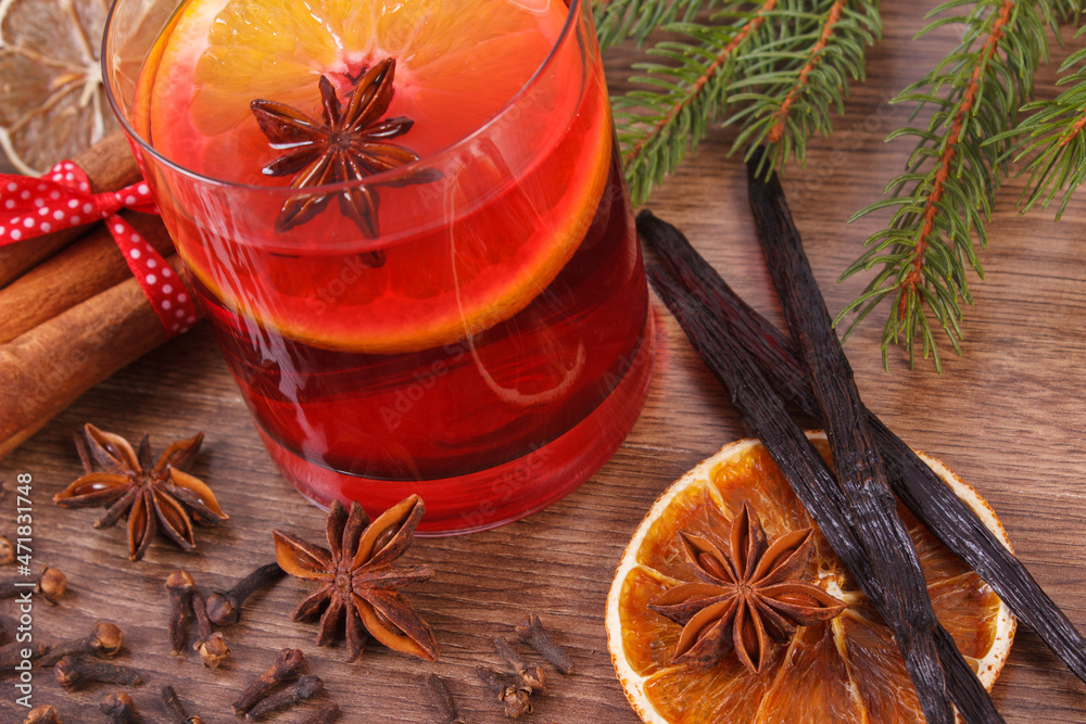 Mulled wine for christmas or winter evening with spices and spruce branches
