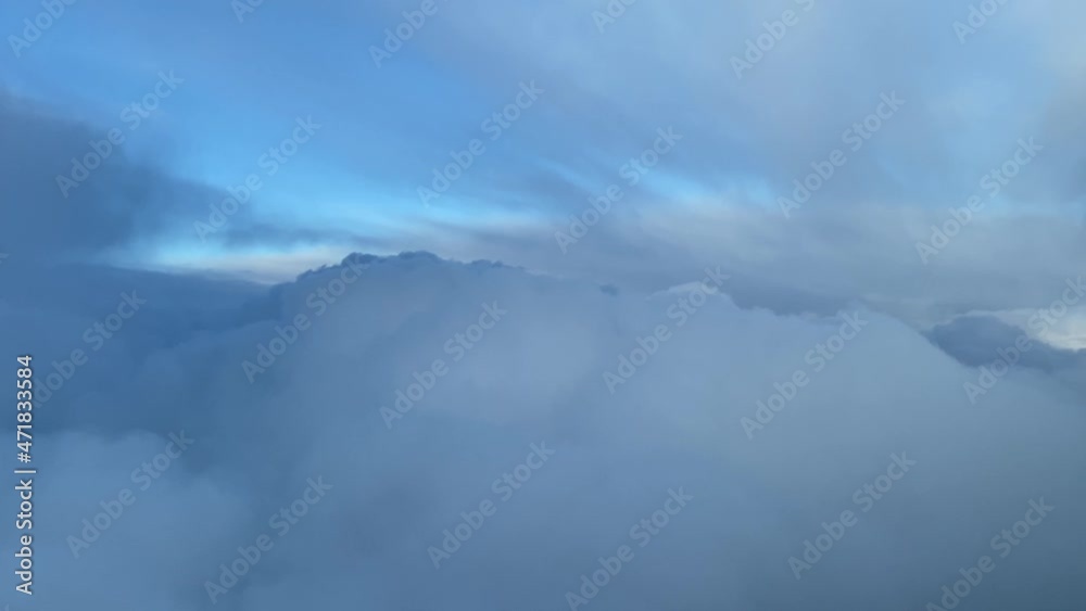Flyin toward a snow cloud during daylight with a blue sky Flyin toward a snow cloud during daylight with a blue sky