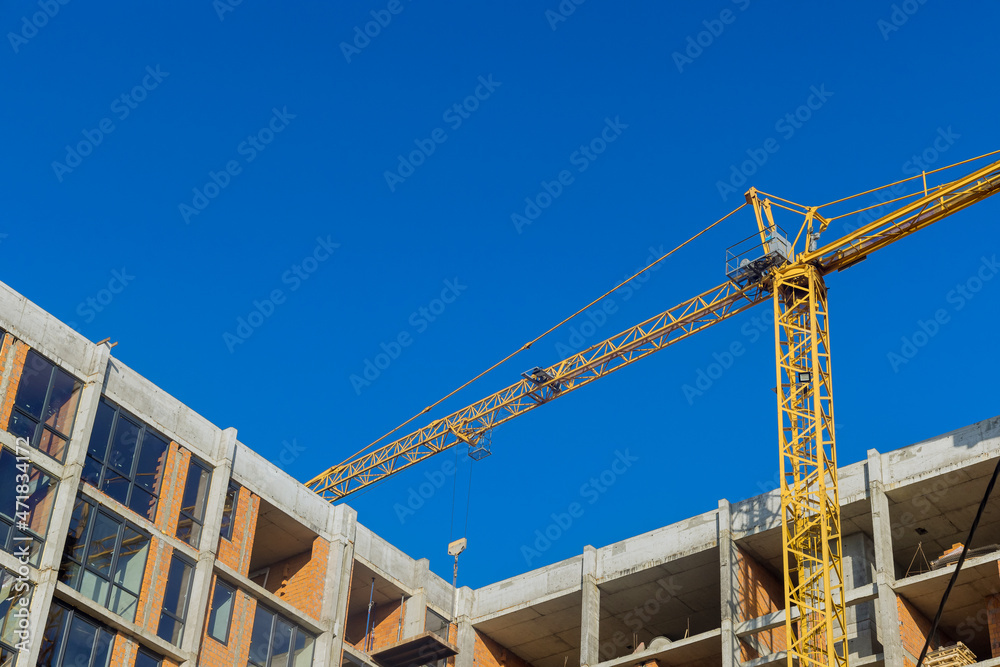Aerial top view of construction site new multi-storey buildings tower crane with unfinished high-rise building Aerial top view of construction site new multi-storey buildings tower crane with unfinished high-rise building