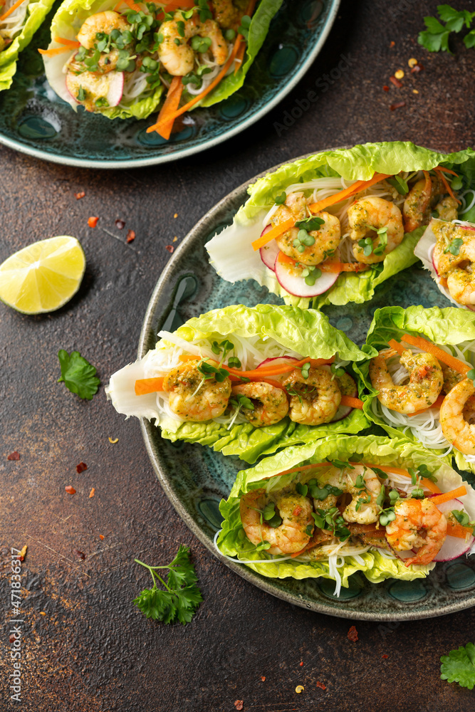Lettuce wraps with Spicy prawn, shrimp and rice vermicelli noodles. Asian style finger party food Lettuce wraps with Spicy prawn, shrimp and rice vermicelli noodles. Asian style finger party food
