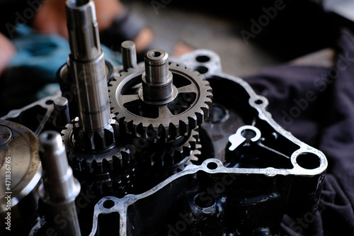 Assemble the motorcycle engine gear by a maintenance technician and check it.