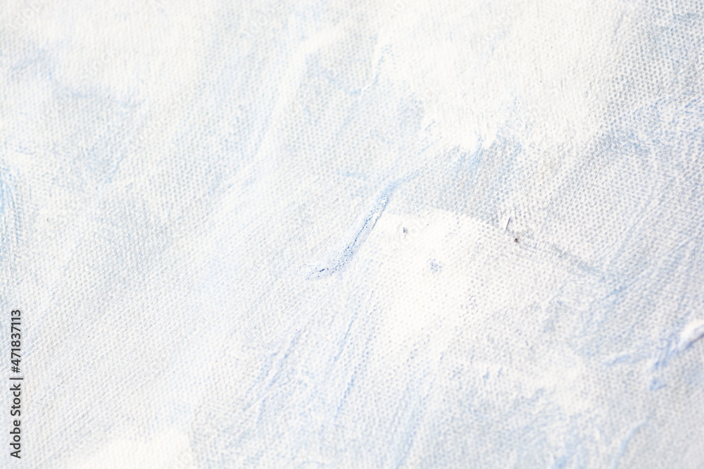 Obraz premium Christmas festive abstract background with natural canvas painting texture. White snow wallpaper. Snowstorm backdrop. Light paint for Christmas banner, xmas decoration, snow New Year design.