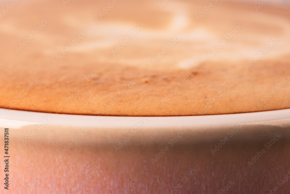 Macro view, cup of freshly made cappuccino coffee Macro view, cup of freshly made cappuccino coffee