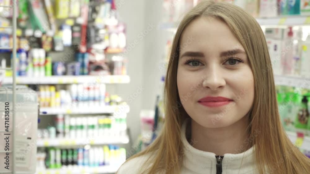 Happy natural young woman in supermarket. Looking camera Happy natural young woman in supermarket. Looking camera