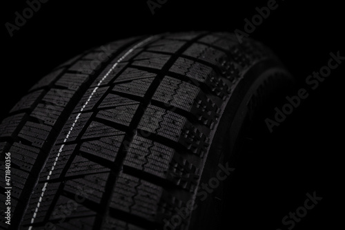 winter tire close up on black background