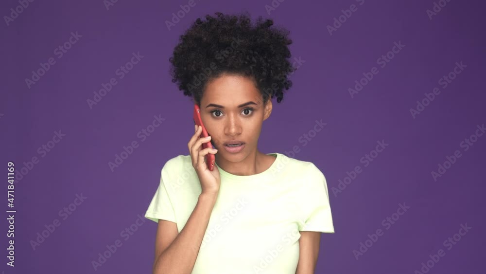 Furious lady yell ex boyfriend smart phone isolated violet color background Furious lady yell ex boyfriend smart phone isolated violet color background