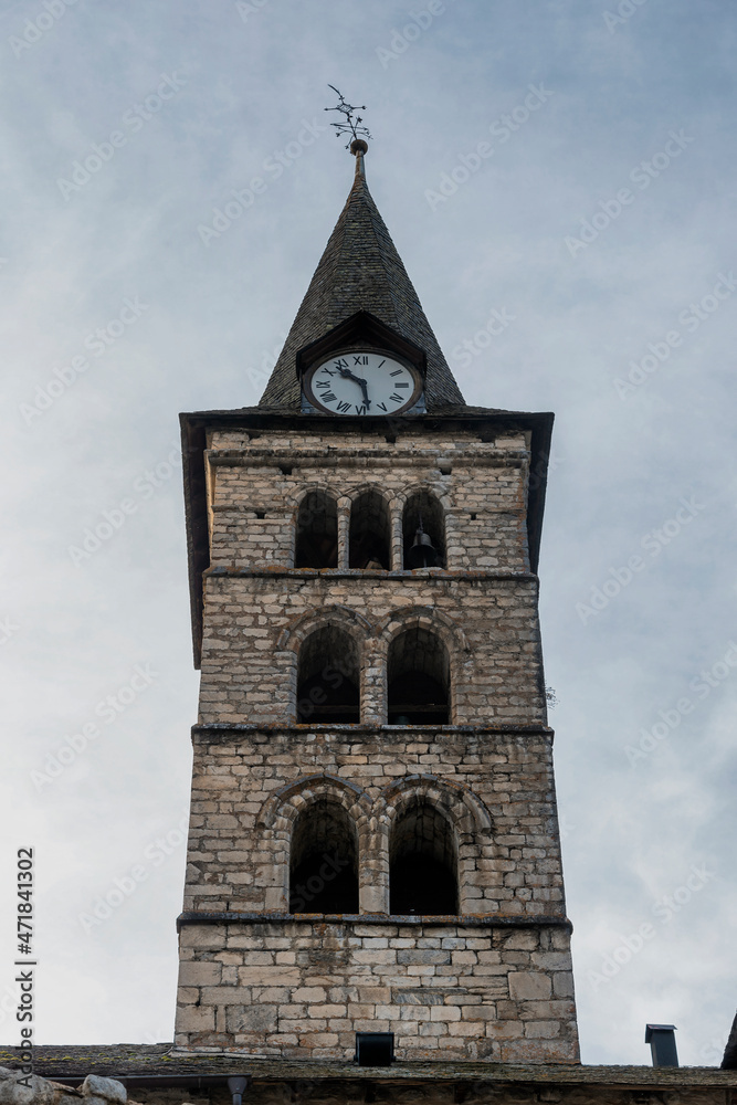 View of the tower of the old medieval church in the town of Arties, in the Aran Valley, Spanish Pyrenees