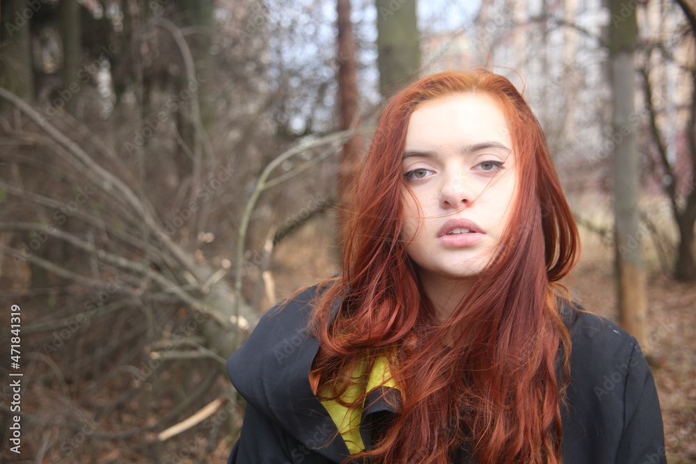 Closeup portrait of a young woman in a forest girl red hair romantic portrait pretty cute face female tree outdoors fashion model beauty lifestyle people Closeup portrait of a young woman in a forest girl red hair romantic portrait pretty cute face female tree outdoors fashion model beauty lifestyle people