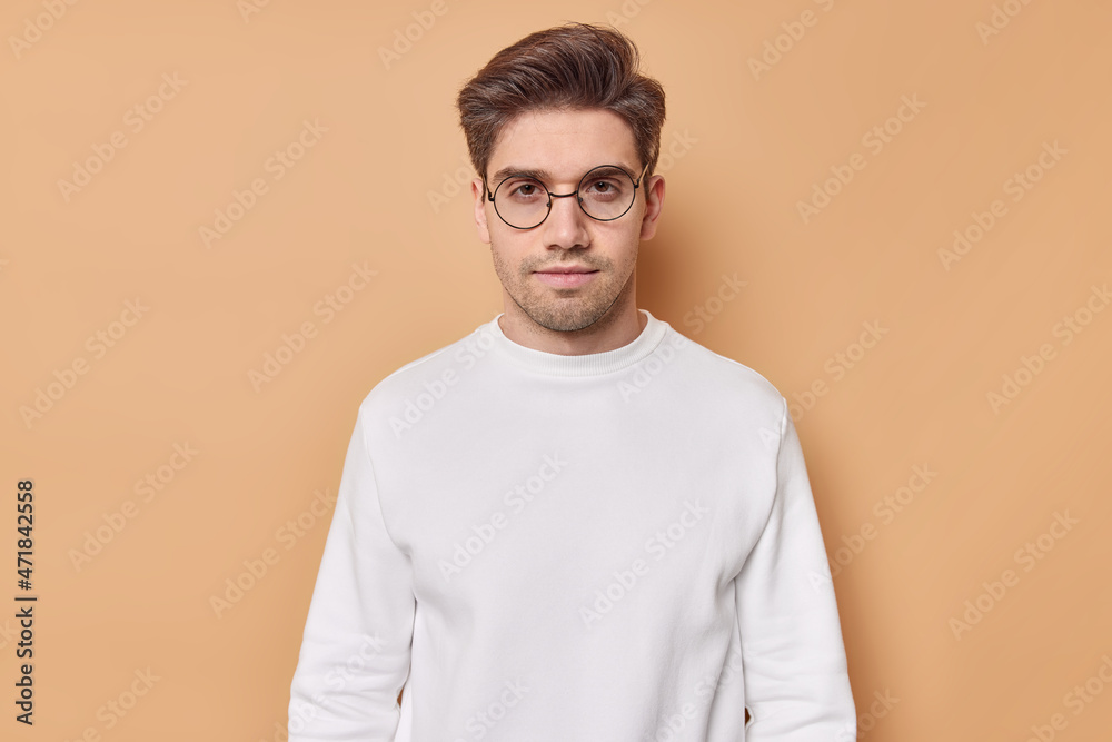 Premium Photo  Man looks directly without emotions listens