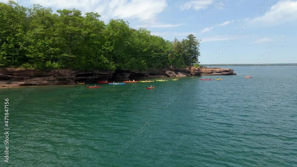 Aerial view of Kayakers on a summer afternoon at Lake Superior, Madeline island Big bay state park at the Apostle island. Travel and explore Wisconsin Aerial view of Kayakers on a summer afternoon at Lake Superior, Madeline island Big bay state park at the Apostle island. Travel and explore Wisconsin