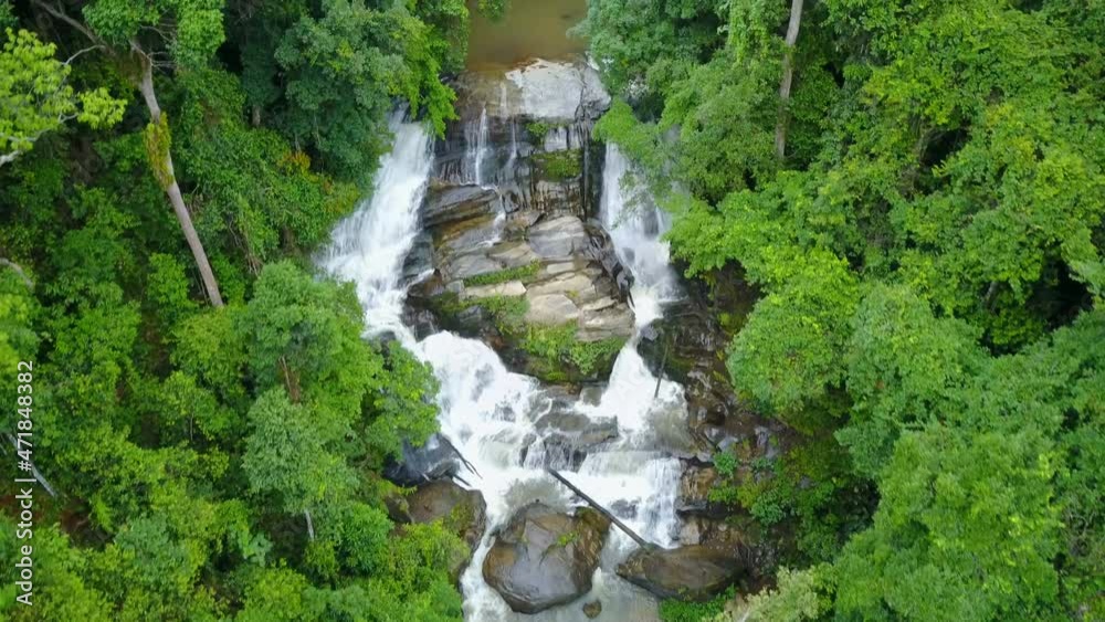 Aerial view of Sirithan waterfall with spray of water Splashing one of the famous waterfall at Doi Inthanon National Park mountain. Located in Chiang Mai, Thailand. Aerial view of Sirithan waterfall with spray of water Splashing one of the famous waterfall at Doi Inthanon National Park mountain. Located in Chiang Mai, Thailand.