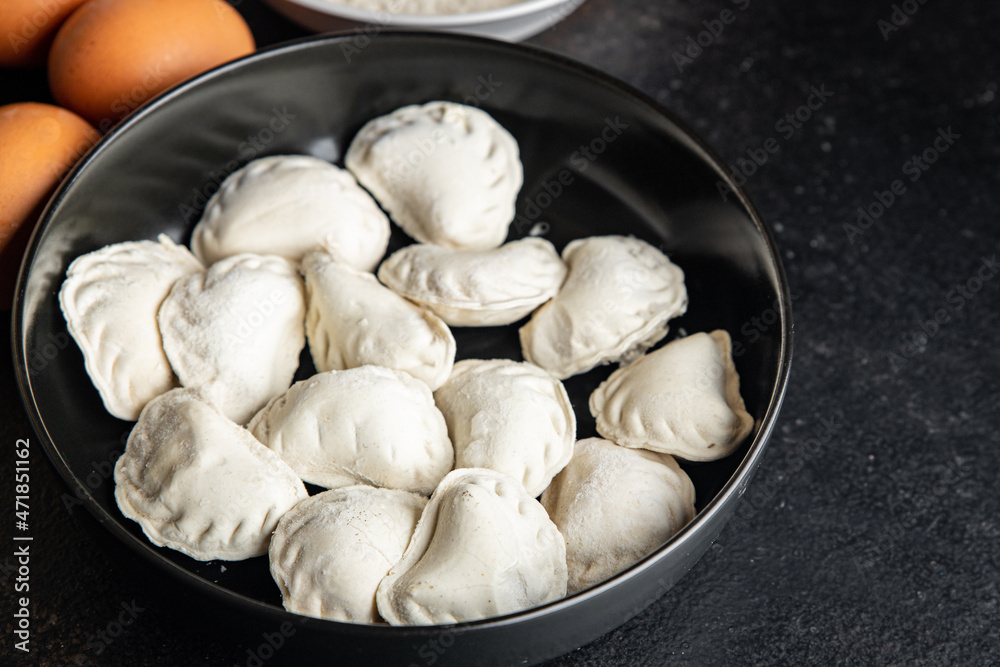 vareniki raw stuffed dumplings ready to cook meal snack on the table copy space food background vareniki raw stuffed dumplings ready to cook meal snack on the table copy space food background