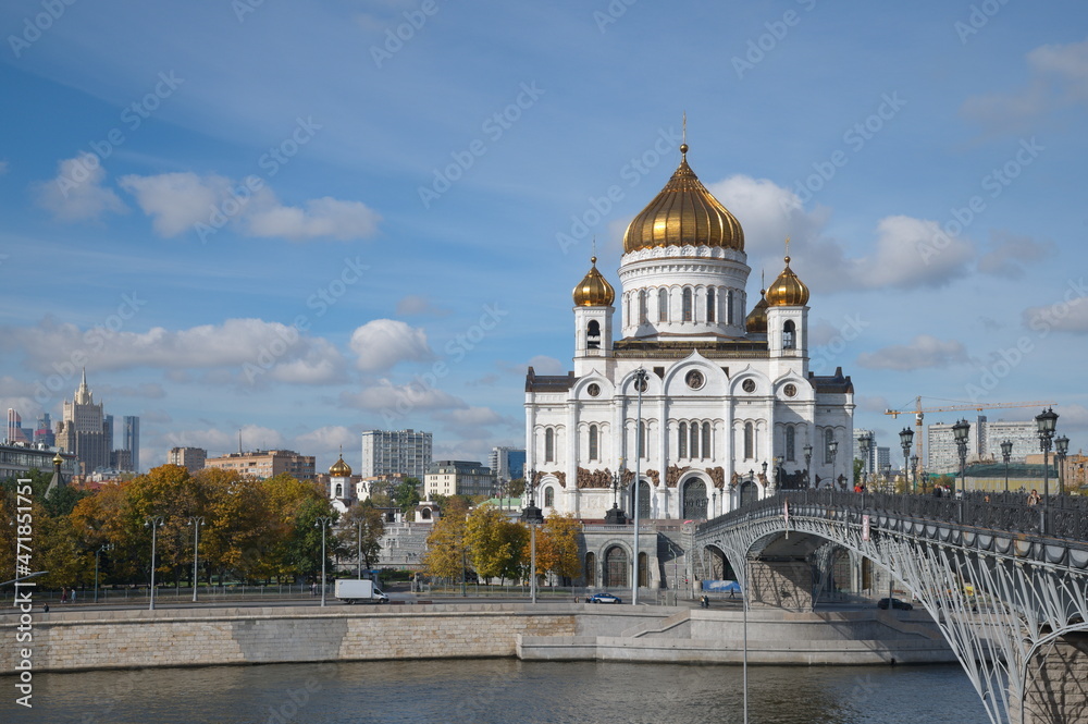 Moscow, Russia - September 29, 2021: View of the Cathedral of Christ the Savior and the Patriarchal Bridge across the Moscow-River on an autumn sunny day