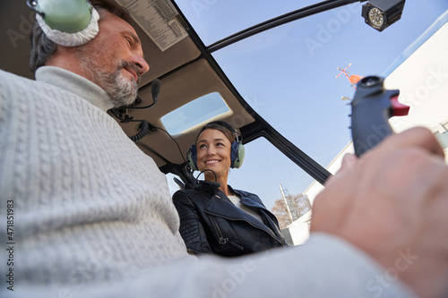 Lovely woman and her man enjoying a helicopter flight together photo