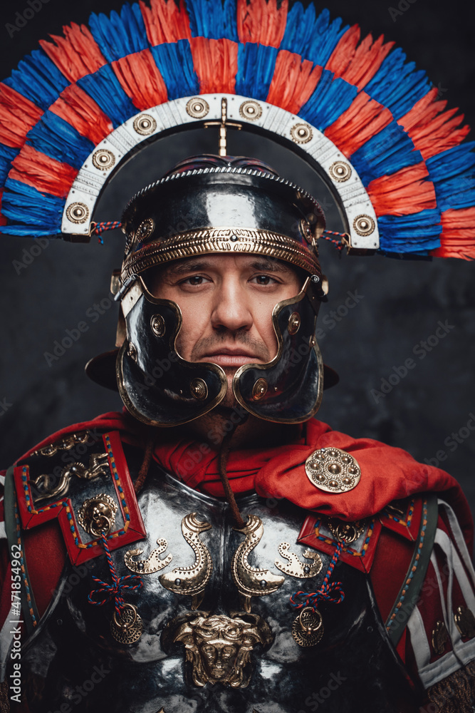 Studio shot of brave roman soldier with colorful plumed helmet