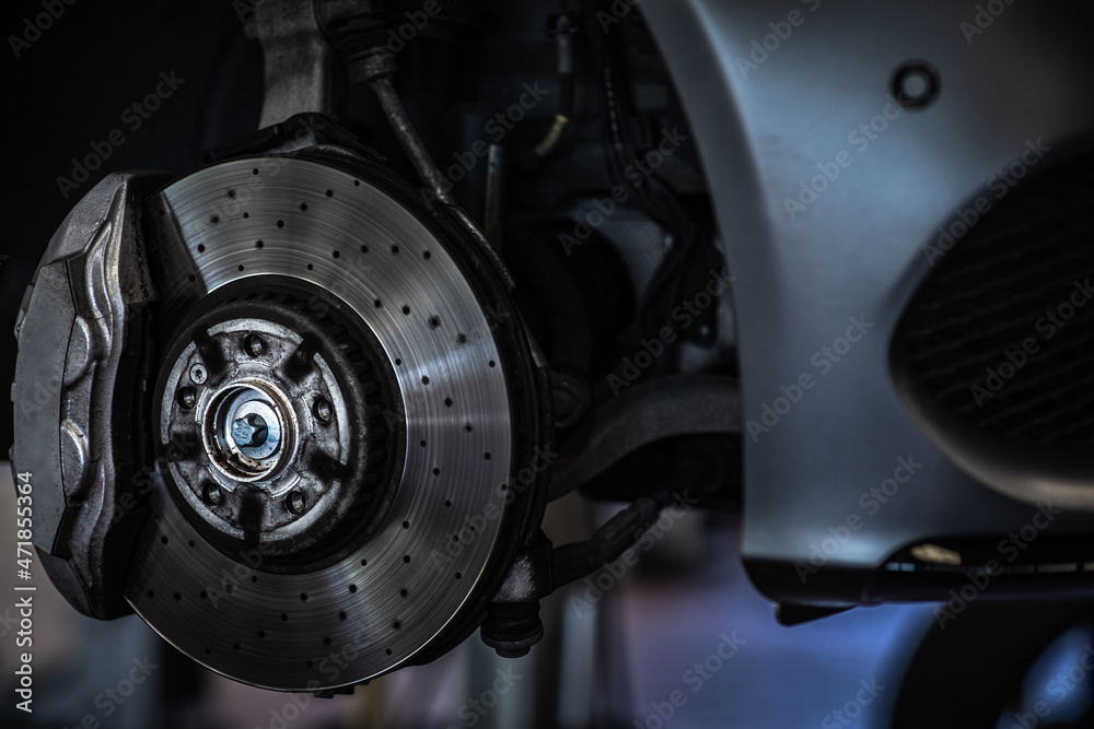 Tyre change - wheel balancing or repair and change car tire at auto service garage or workshop by mechanic Tyre change - wheel balancing or repair and change car tire at auto service garage or workshop by mechanic