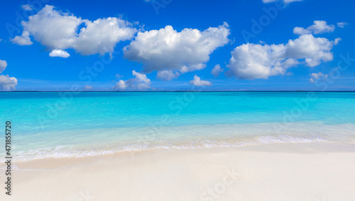 Closeup of sand on beach and blue summer sky. Panoramic beach landscape. Empty tropical beach and seascape. Orange and golden sunset sky, soft sand, calmness, tranquil relaxing sunlight, summer vibes
