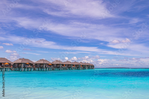 Tropical seascape with water bungalows in the Maldives. Peaceful seaside, stunning beach. Destination for honeymoon and perfect couple vacations. Luxury traveling landscape with copy space © icemanphotos