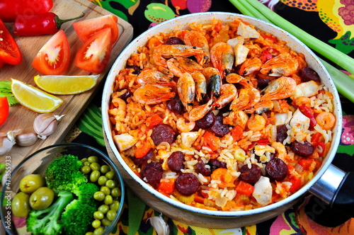 Creole jambalaya with spicy rice with meat and vegetables and shrimp