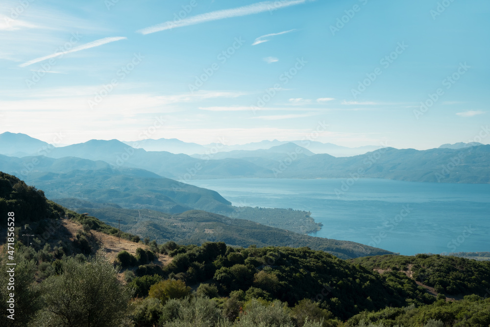 Beautiful light landscape,view at Trichonida lake in Greece, mountains, summer morning.Travelling, beauty in nature concept.Copy space