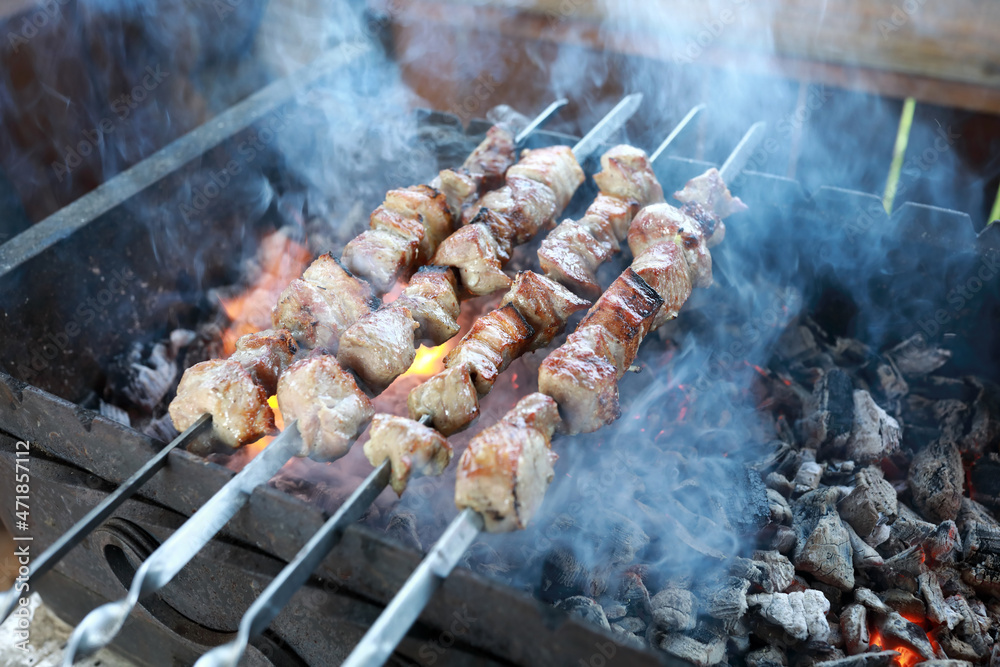 Cooking pork meat on skewers Cooking pork meat on skewers