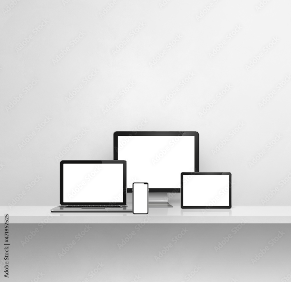 Computer, laptop, mobile phone and digital tablet pc. white concrete shelf background