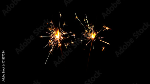 Burning sparklers on black background. Burning New Year sparklers