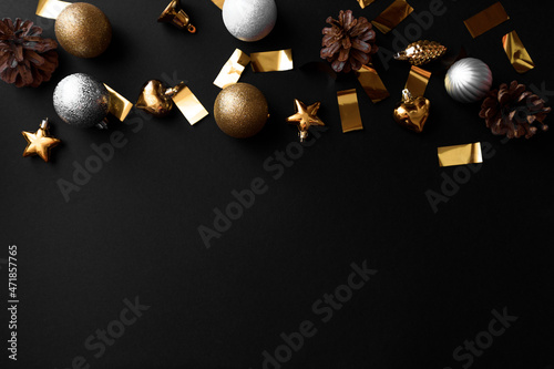 new year gifts and decorations on black background top view.