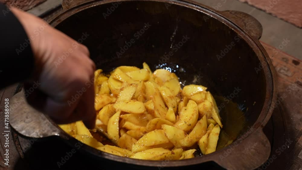 frying potatoes in a frying pan. homemade food. prefronts frying potatoes in a frying pan. homemade food. prefronts