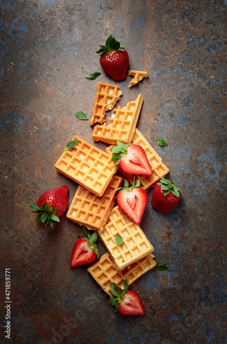 Waffles with juicy strawberries.