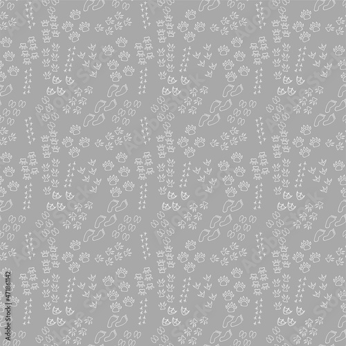 Seamless background. Drawn by hand. Traces of humans, birds and animals are depicted on a gray background. Can be used for fabric, wallpaper, background, wrapping paper.
