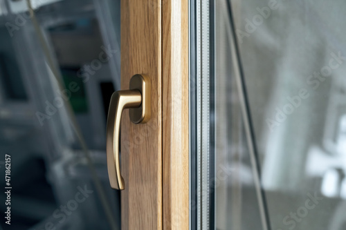 Obraz na płótnie stylish handle on the window frame in gold color. w salonie
