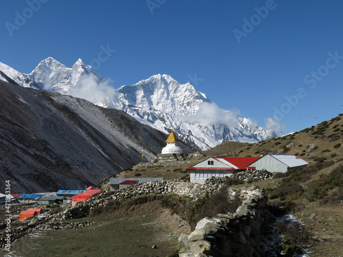 Stupa in Dingboche and high mountain Thamserku. photo