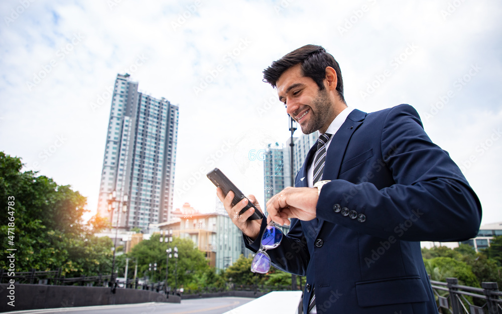 Handsome businessman uses his smartphone to connect data and global business with the speed of 6g technology. Abstract world network connection, internet and global connection concept. Handsome businessman uses his smartphone to connect data and global business with the speed of 6g technology. Abstract world network connection, internet and global connection concept.