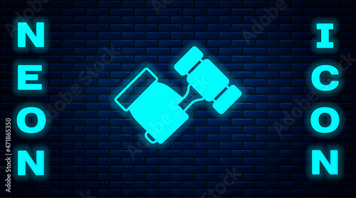 Glowing neon Auction hammer icon isolated on brick wall background. Gavel - hammer of judge or auctioneer. Bidding process, deal done. Auction bidding. Vector