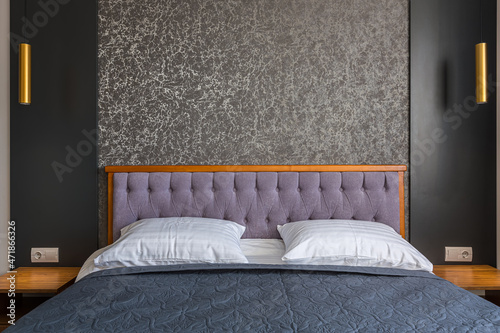 Quadro su tela Interior of a modern hotel room with a large double bed