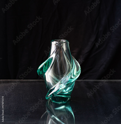 Mid-century modern glass vase isolated on black background