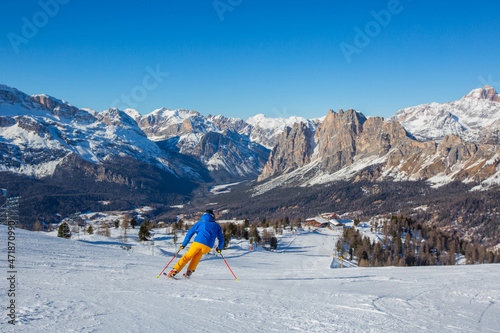 Alpine skier on slope at Cortina photo