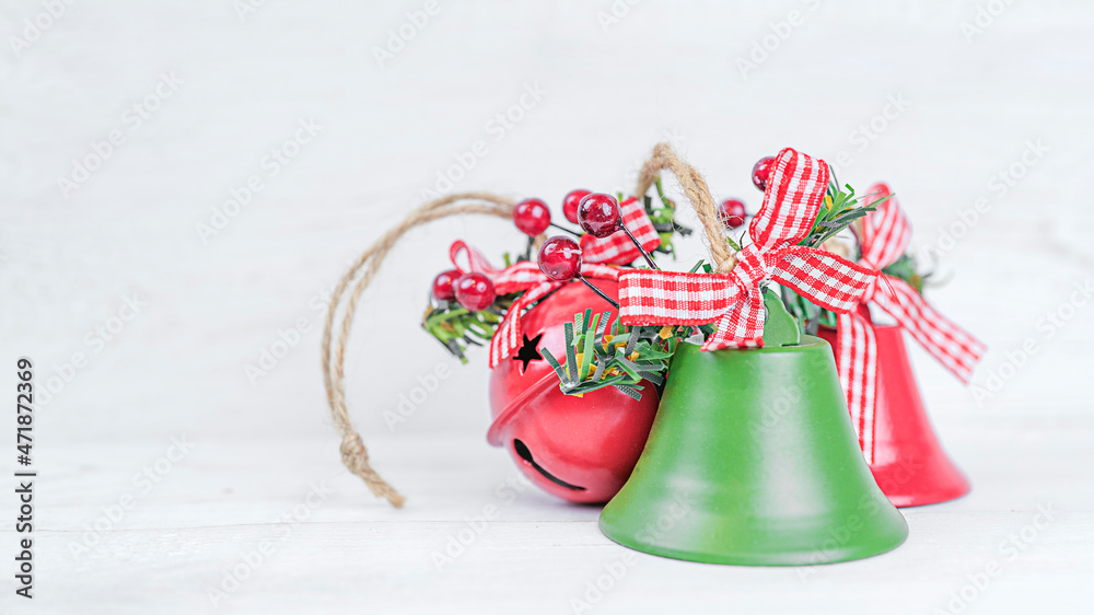 Christmas bells on white wooden background with copy space