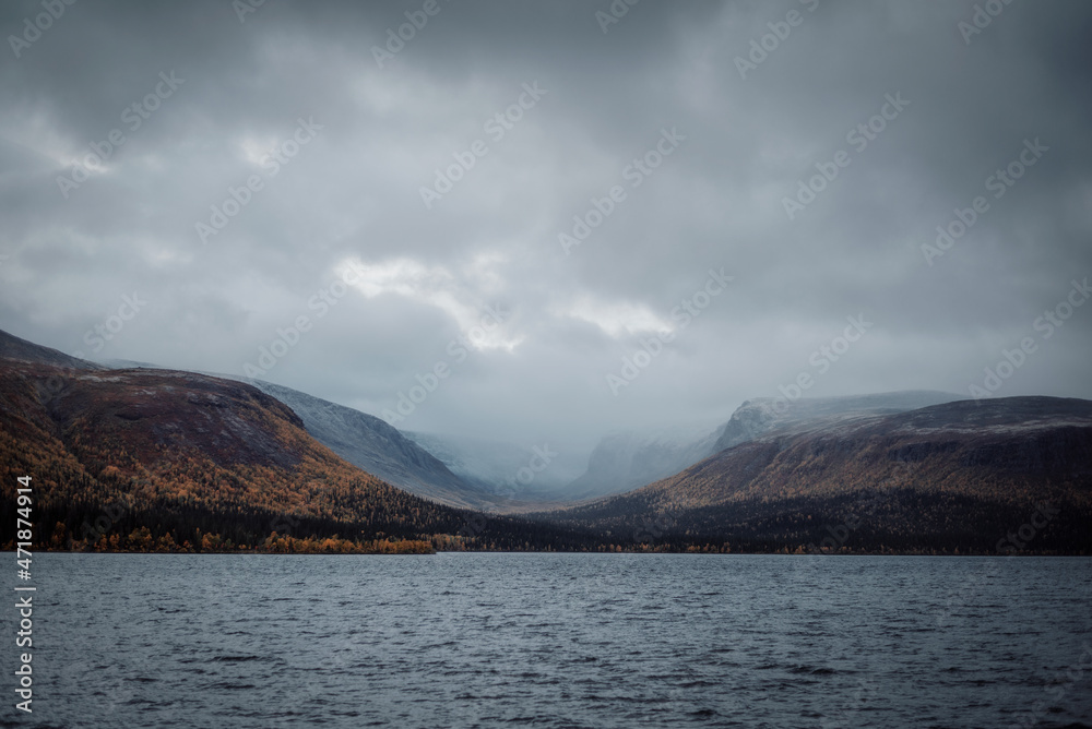 View of the lake and mountains in cloudy weather