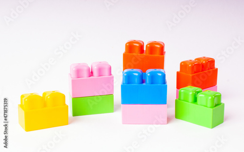 Children's colored plastic constructor on a light background.