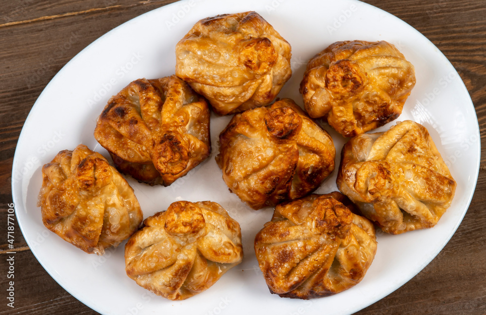 Fried khinkali in a white plate.Georgian cuisine. Fried khinkali in a white plate.Georgian cuisine.