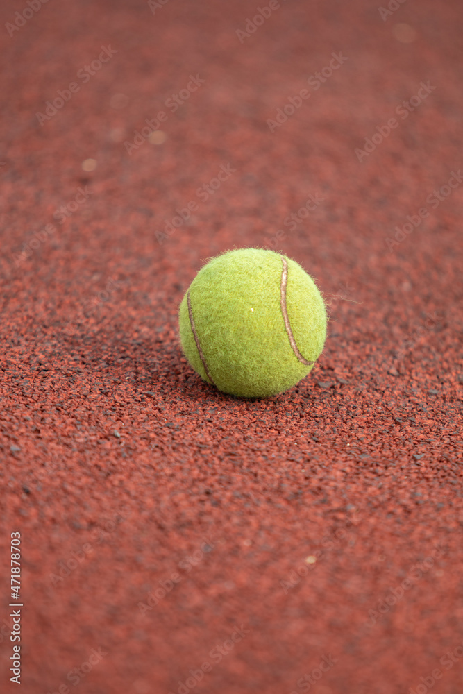 Tennis ball on the map, close-up.