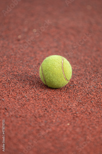 Tennis ball on the map, close-up. © Prikhodko