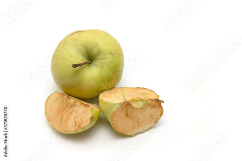 Slices of an old apple on a white background. photo