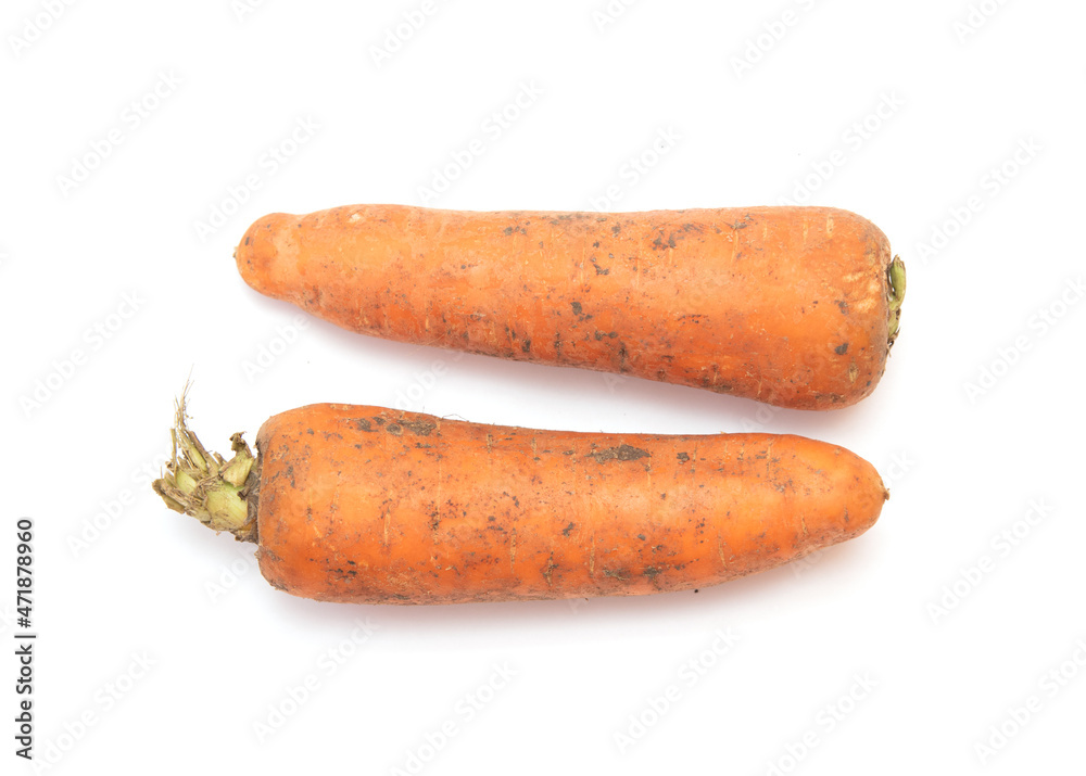 Dirty carrots on a white background. Dirty carrots on a white background.